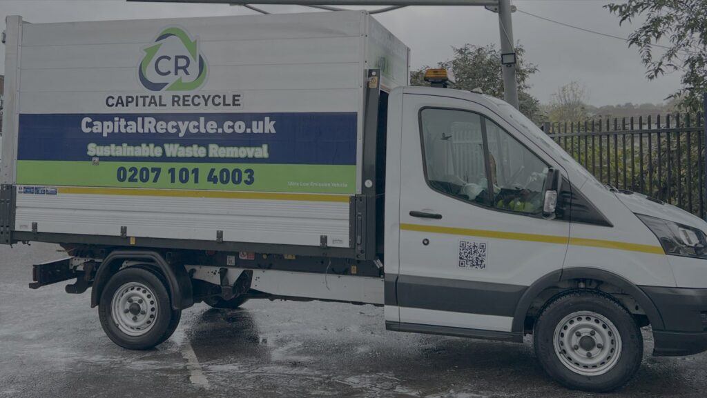 A Capital Recycle caged tipper in full livery on a London street