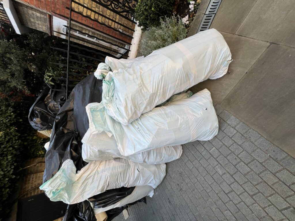Capital Recycle branded general waste sacks awaiting collection at a London business