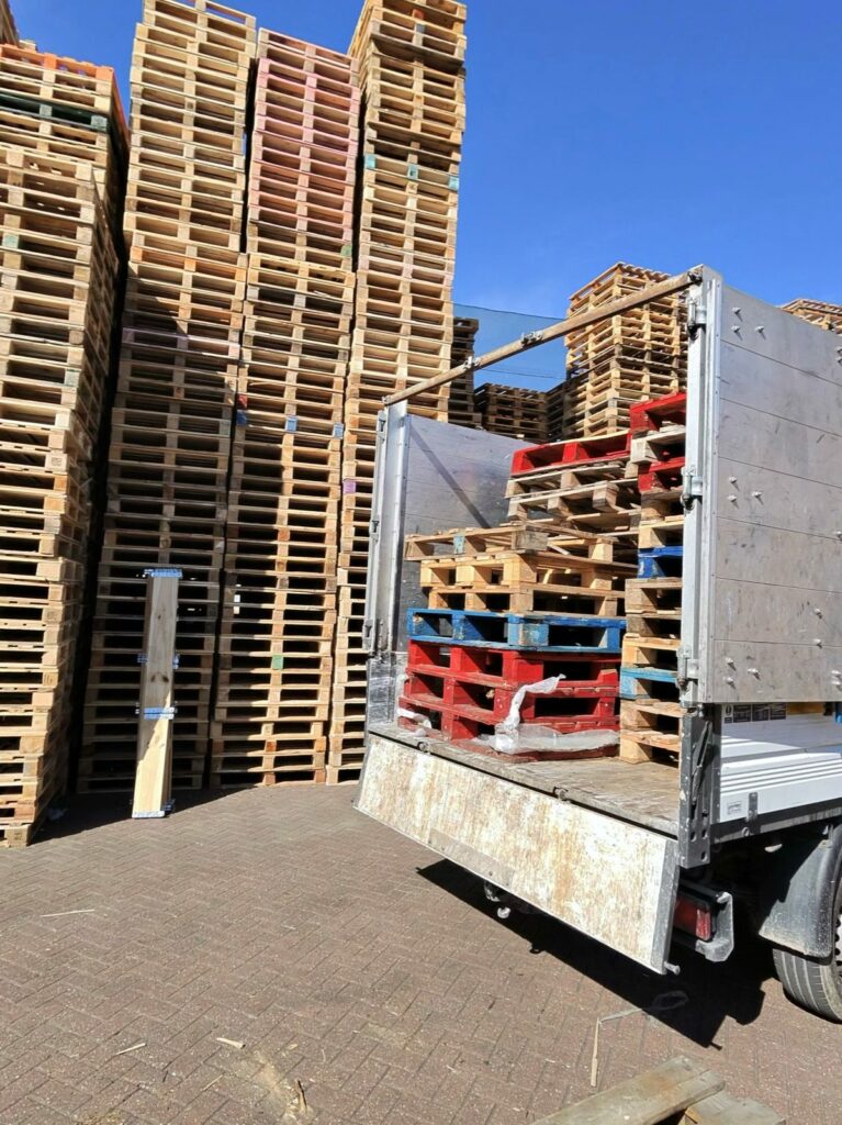 Stacked EPAL pallets loaded for collection and routed to the wood recycling stream