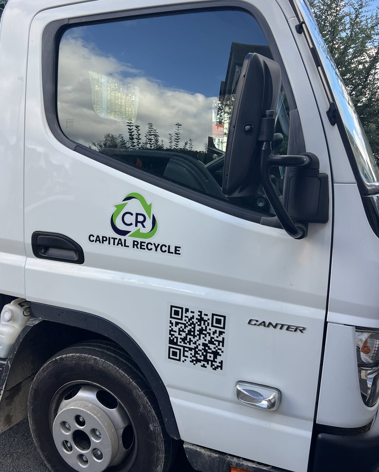 Capital Recycle logo and QR code on the cab door of our new caged tipper